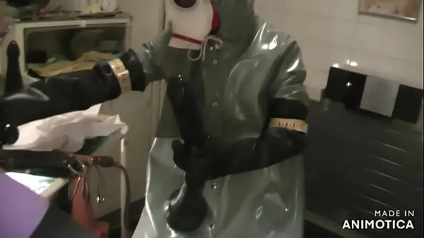 Hot Rubbernurse Agnes - Heavy Rubber green clinic gown with hood and white gasmask - deep pegging with two colonoscope-style dildos - final deep analfisting with thick chemical gloves and cum วิดีโอใหม่